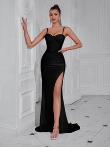 Detail of elegant black slit evening dress with corset bodice and satin finish
