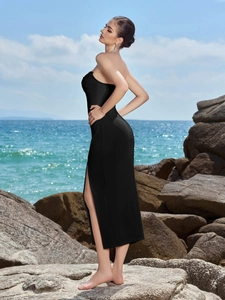 Elegant black strapless midi dress with a high side slit for evening parties and beach events
