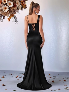 Detail of the elegant black satin evening dress showing the criss-cross backless tie design