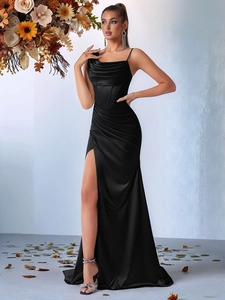 Detail of elegant black satin evening dress with corset bodice and high side slit