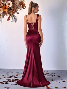Detail of the cross back tie-up design on a wine red satin formal evening gown for women