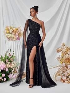 Elegant black one-shoulder sequin evening gown with mesh cape and high slit design