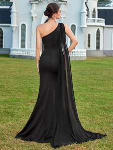 Elegant black one-shoulder evening gown with a flowing chiffon cape and mermaid silhouette