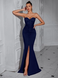Detail of dark blue tube top evening dress with side slit and decorative buttons