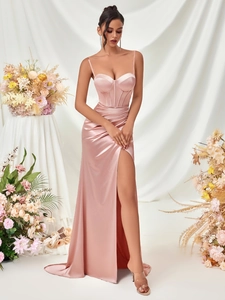 Detail of pink satin evening dress with bustier top, ruched waist and side slit
