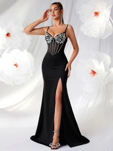 Elegant black evening gown with rhinestone petals, fishbone bodice and high slit design