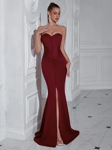 Close-up of wine red strapless evening dress showing buttons and waist pleats