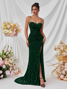 Detailed view of dark green sequin gown showing spaghetti straps and high slit design