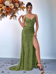 Detail of sequins texture on olive green fishtail evening gown with a high slit