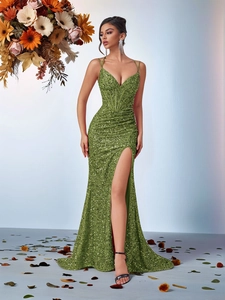 Detailed view of olive green sequined evening dress with boned bodice and deep V-neckline