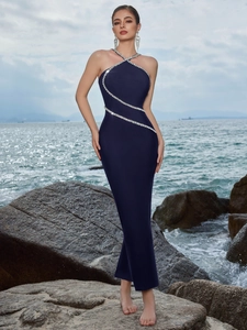 Detail view of shimmering rhinestones on a navy blue halter neck mermaid evening gown