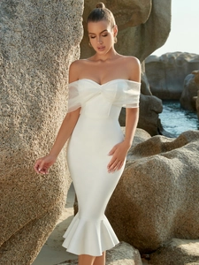 Detail of off-shoulder mesh fold and elegant white mermaid hemline on party dress