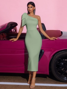 Detailed close-up of mint green one-shoulder dress with elegant pleats and satin finish