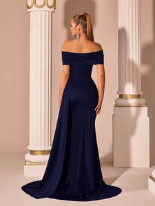 Detail view of navy blue satin mermaid dress with elegant pleated train and back slit