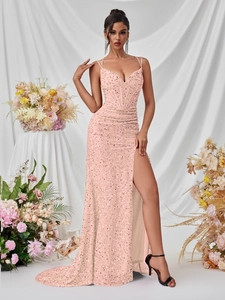 Close-up of pink sequined evening gown showing the structured corset bodice and thin straps