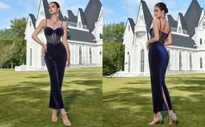 Detail of midnight blue velvet dress featuring sheer waist mesh and a high back slit