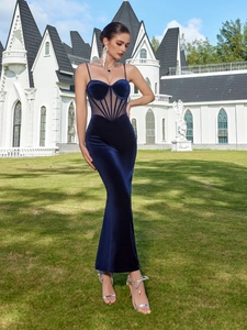Detailed view of navy velvet evening dress with sheer mesh waist and mermaid silhouette