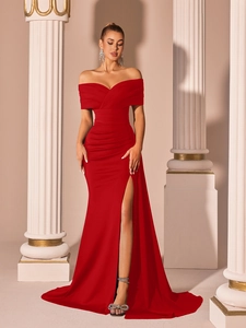 Detail of red off-shoulder satin evening gown with ruched bodice and high side slit