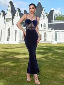 Detailed view of dark blue velvet corset bodice with mesh inserts and delicate straps