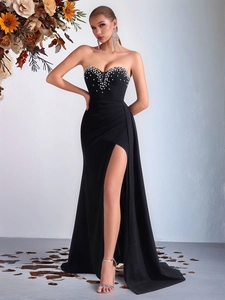 Elegant black strapless evening gown with pearl rhinestones and a high side slit detail