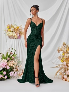 Deep green sequined V-neck evening gown with spaghetti straps and high slit detail