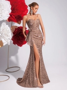 Champagne sequin evening gown with spaghetti straps, side slit, and mermaid hem