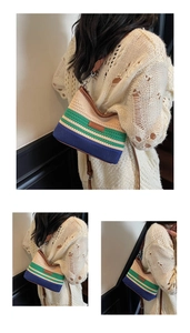 Detail showing tricolor woven texture with brown leather strap on a stylish bucket bag