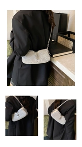 Detail showing metallic silver shoulder bag with glitter finish and leopard texture accents