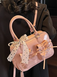 Borsa a mano in pelle verniciata rosa con fiocchi e foulard a pois moda femminile