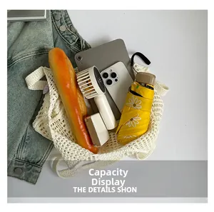 Top view of large knit tote bag showing spacious interior with tablet and daily essentials