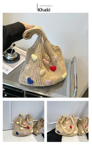 Close-up of hand-crocheted tote bag with colorful 3D hearts and hollow knit texture