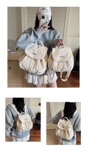 Detail of cream canvas drawstring backpack with contrast cords and woven brand patch