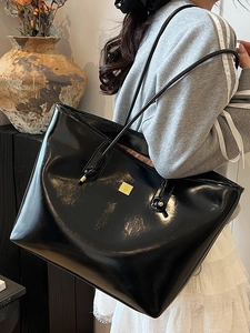 Large capacity black shiny faux leather tote bag with gold logo for daily commuting