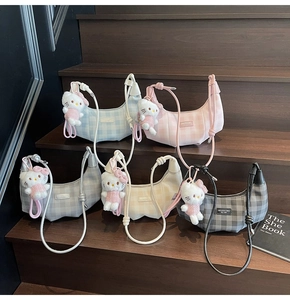 Detailed grid view of five large checkered underarm bags with cute plush charms