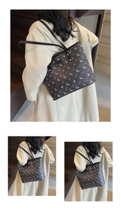 Detailed view of large tote bag featuring vintage elk prints and black shoulder straps