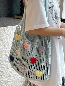 Light blue crochet flower tote bag with colorful 3D heart patches for summer commute