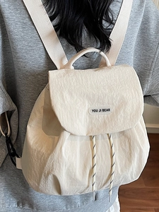 Chic cream-white drawstring backpack with top flap and comfortable wide straps