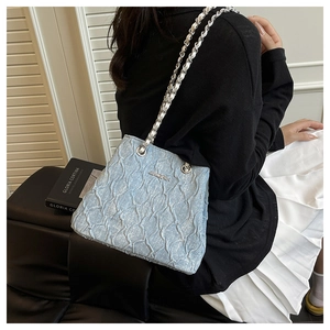 Detail of light blue pleated shoulder bag with silver chain strap and JINGPIN logo