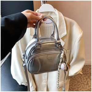 Detail of silver pillow handbag with baseball stitching and CHIO 2ND logo print