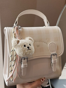 Checkered cream mini backpack with plush bear charm and bow detail for women