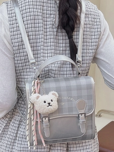 Silver leather plaid backpack for women with plush bear charm and embroidery detail
