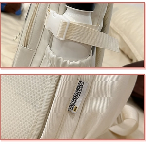 Detail of backpack side pocket with water bottle and adjustable plastic buckle