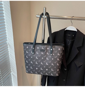 Detailed view of large tote bag with white elk print and reinforced shoulder strap
