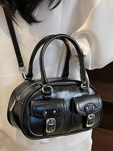 Retro black glossy Boston bag with silver buckles and detachable strap in a crossbody style