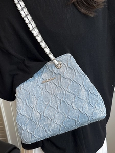 Chic light blue pleated crossbody bag with silver chain strap and metallic logo