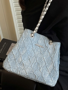 Fashionable light blue pleated shoulder bag with a silver chain strap for women