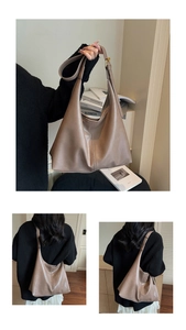 Detail view of large earthy clay brown tote bag showing smooth matte faux leather texture