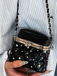 Quilted black mini shoulder bag with rhinestones and vintage metal clasp closure
