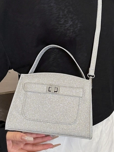 Chic silver glitter handbag for women featuring a classic metal twist lock and top handle
