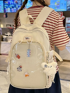 Japanese style cream canvas backpack with transparent PVC front pocket and plush charm